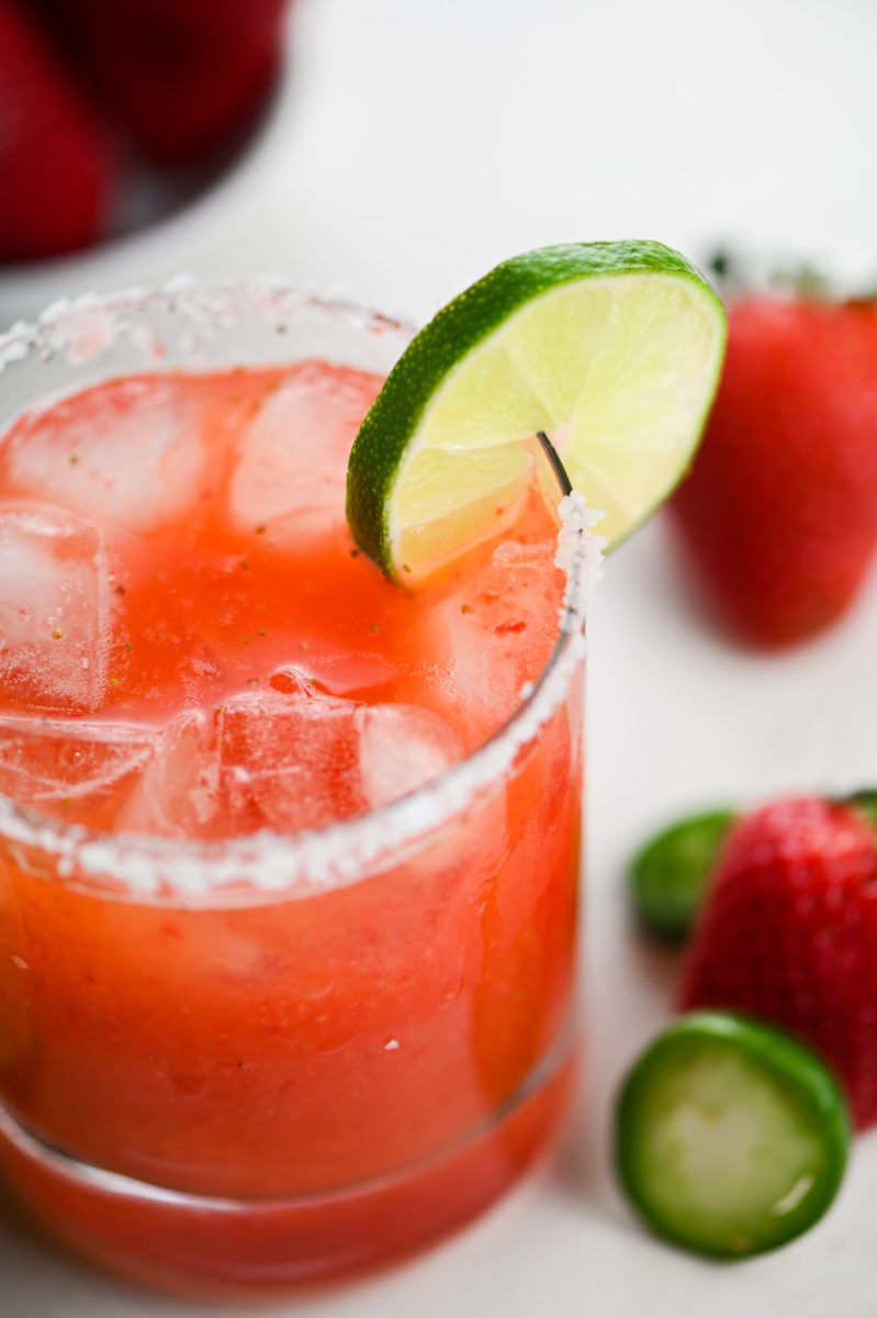 Close up of Jalapeno Margarita with salt rim and lime garnish.