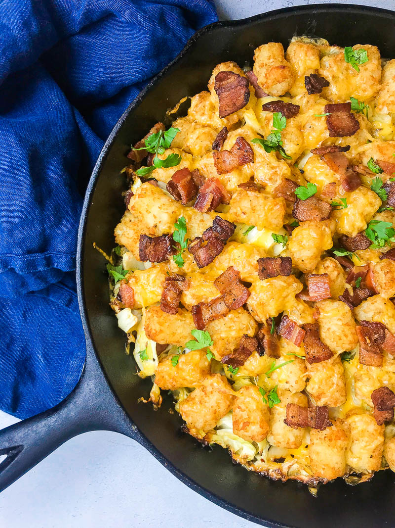 Kielbasa and Cabbage Tater Tot Casserole is comfort food of epic proportions. Sautéed cabbage and kielbasa topped with cheddar cheese and tater tots, then baked until crisp. 