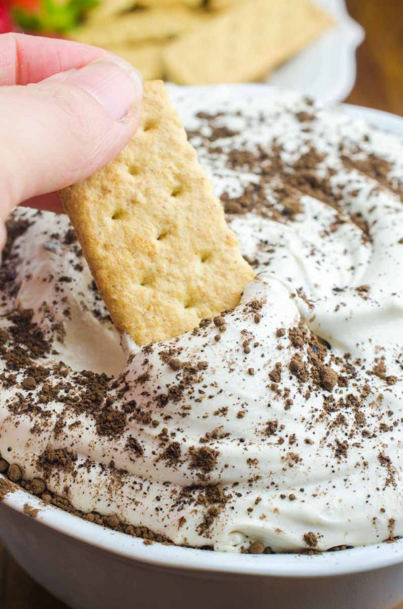 If you are looking for a quick and easy dessert, this Tiramisu Cheesecake Dip is it. It's a creamy, dreamy downright decadent dessert dip for graham crackers and fresh fruit. 