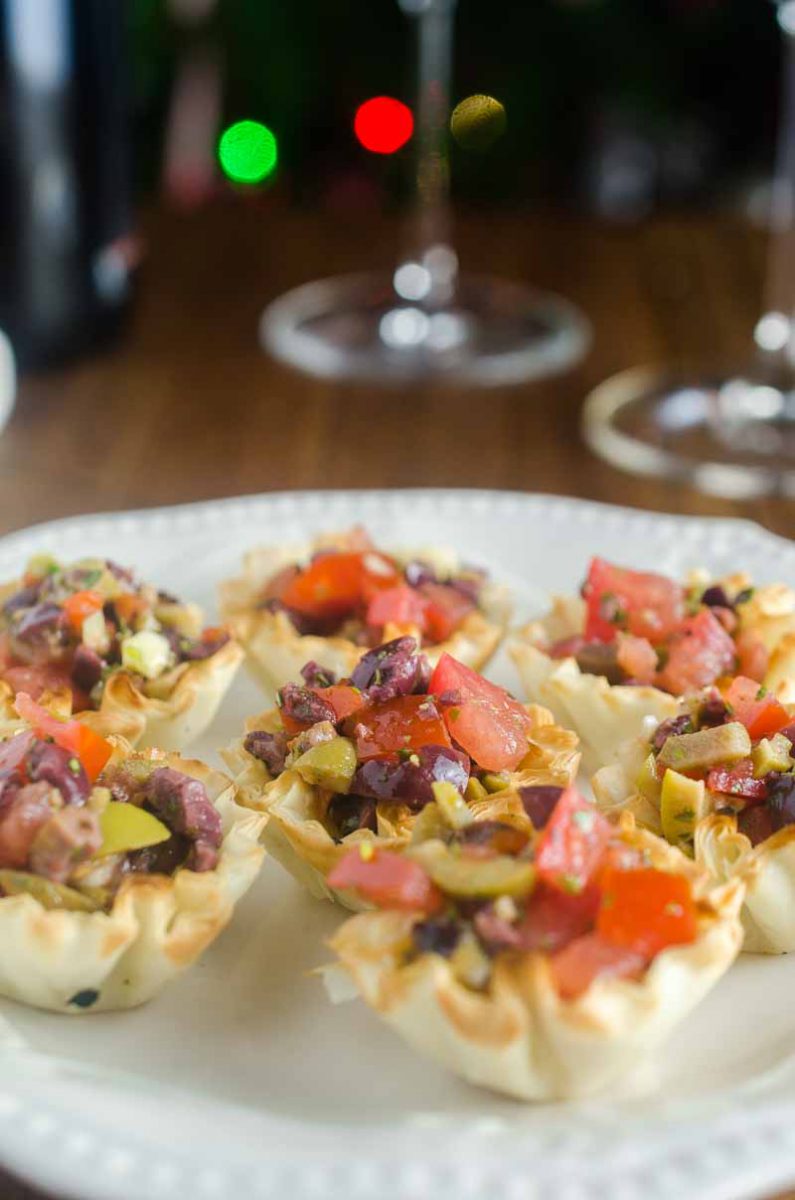 Tomato Olive Phyllo Cups are the perfect party appetizer. Fresh tomatoes and briny olives piled high in crispy phyllo cups. Ready in less than 10 minutes! 