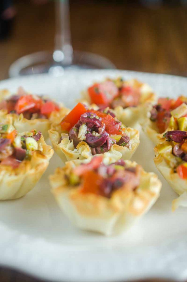 Tomato Olive Phyllo Cups are the perfect party appetizer. Fresh tomatoes and briny olives piled high in crispy phyllo cups. Ready in less than 10 minutes! 