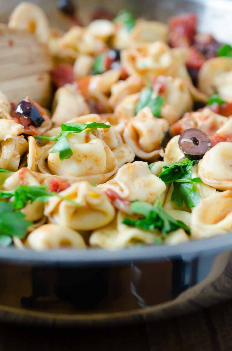 Tortellini Puttanesca is loaded with tomatoes, olives, capers, garlic and red wine. It is a family hit that will make weeknight dinners a breeze!