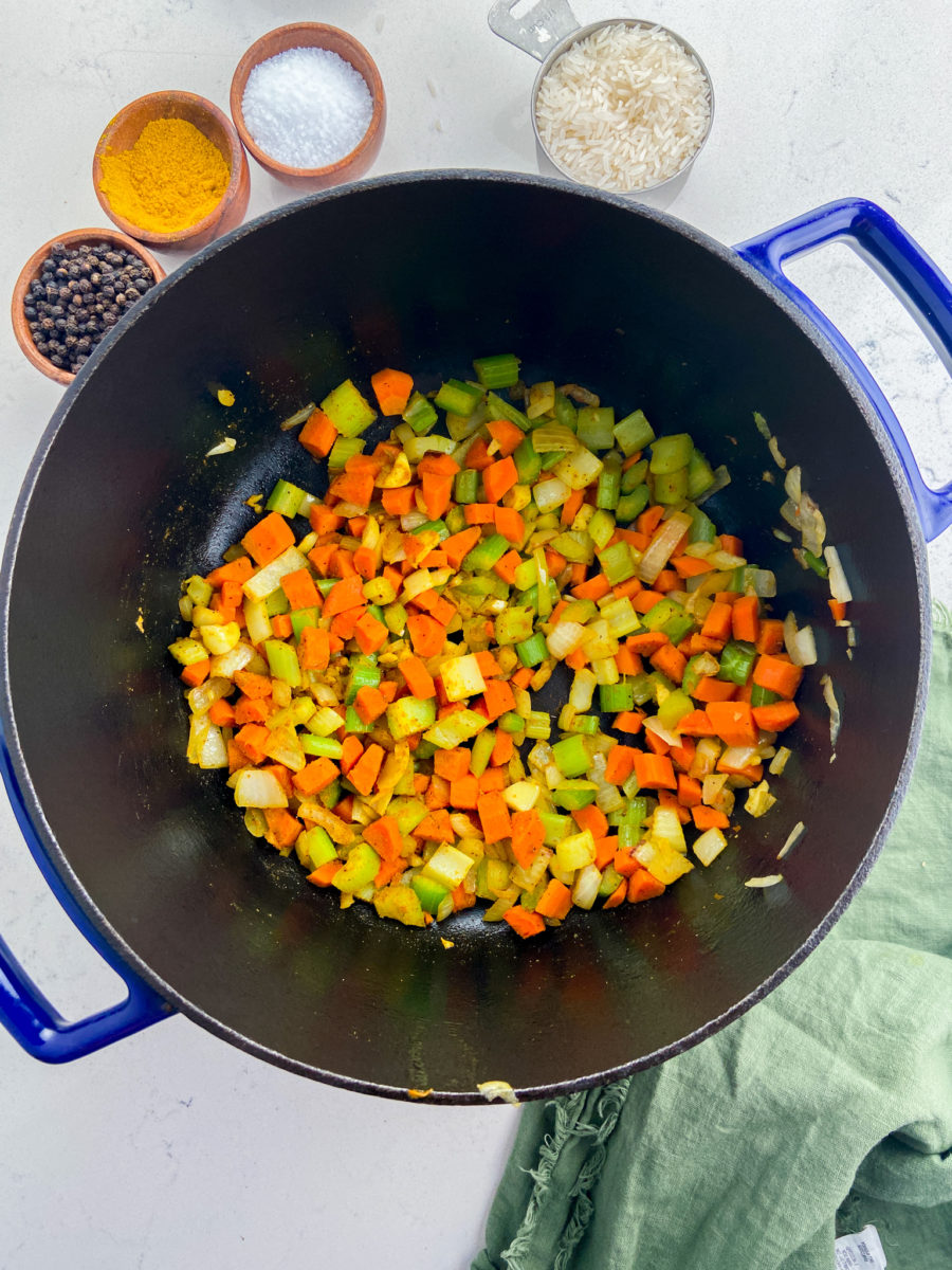 Sauteing vegetables in soup pot. 