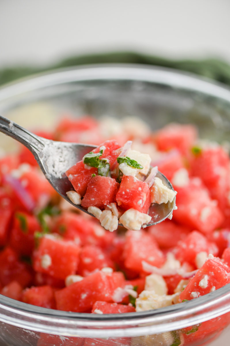 Spoonful of watermelon salad.