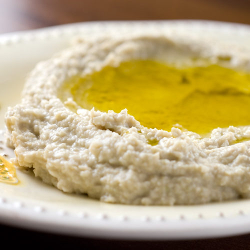 Artichoke hummus on plate.