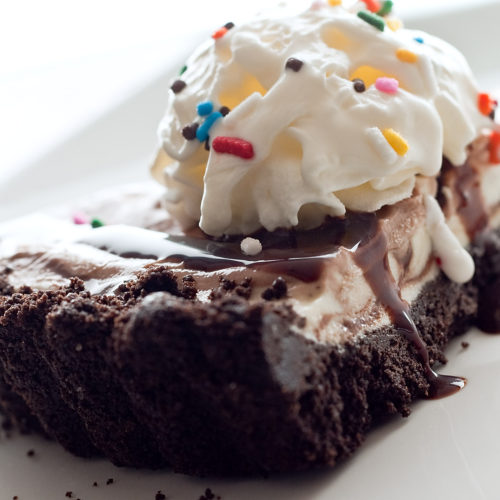 Cake batter ice cream tart on white plate.