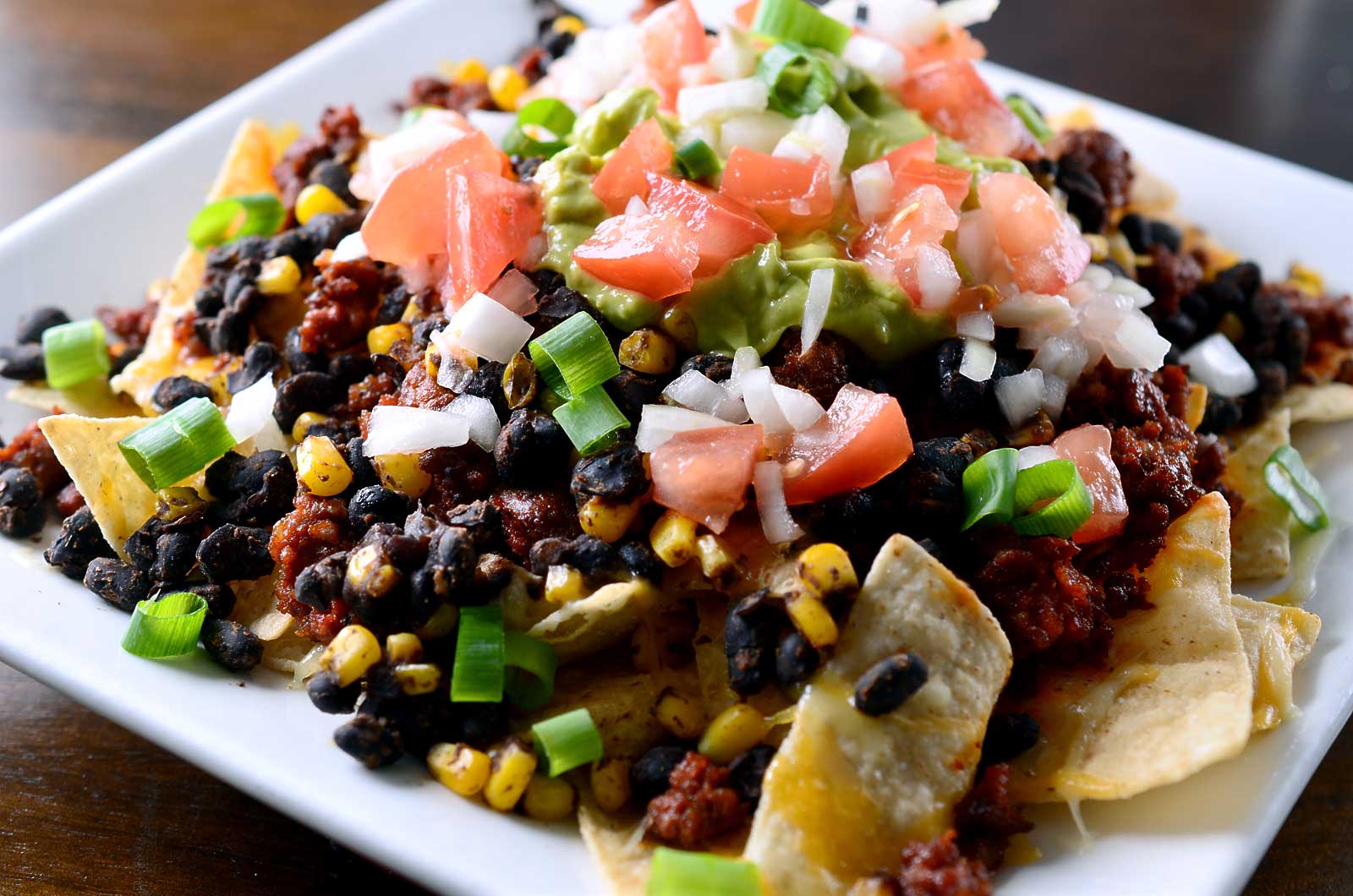 Chorizo Nachos with Chipotle Avocado Cream