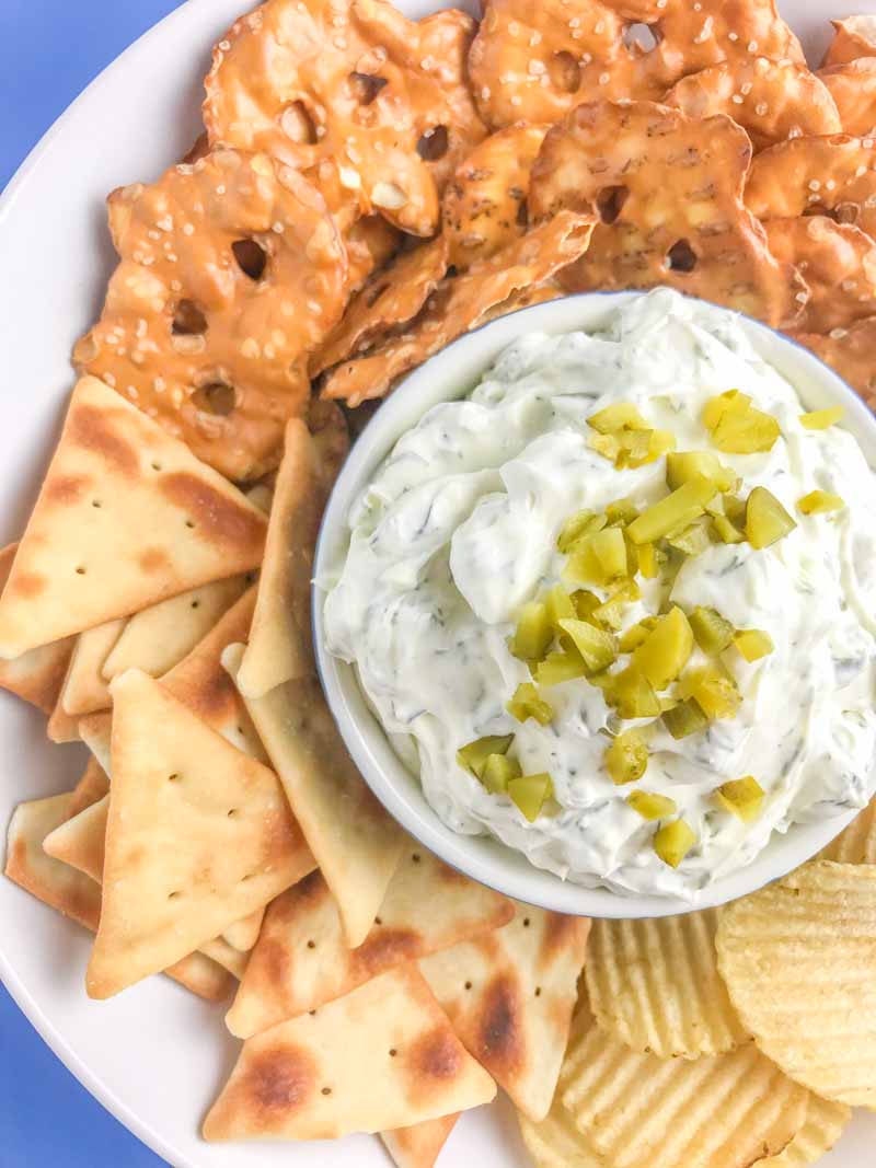 Creamy Dill Pickle Dip is going to be THE dip you'll want to bring to all your summer potlucks. It is super easy to make and a crowd pleaser! 