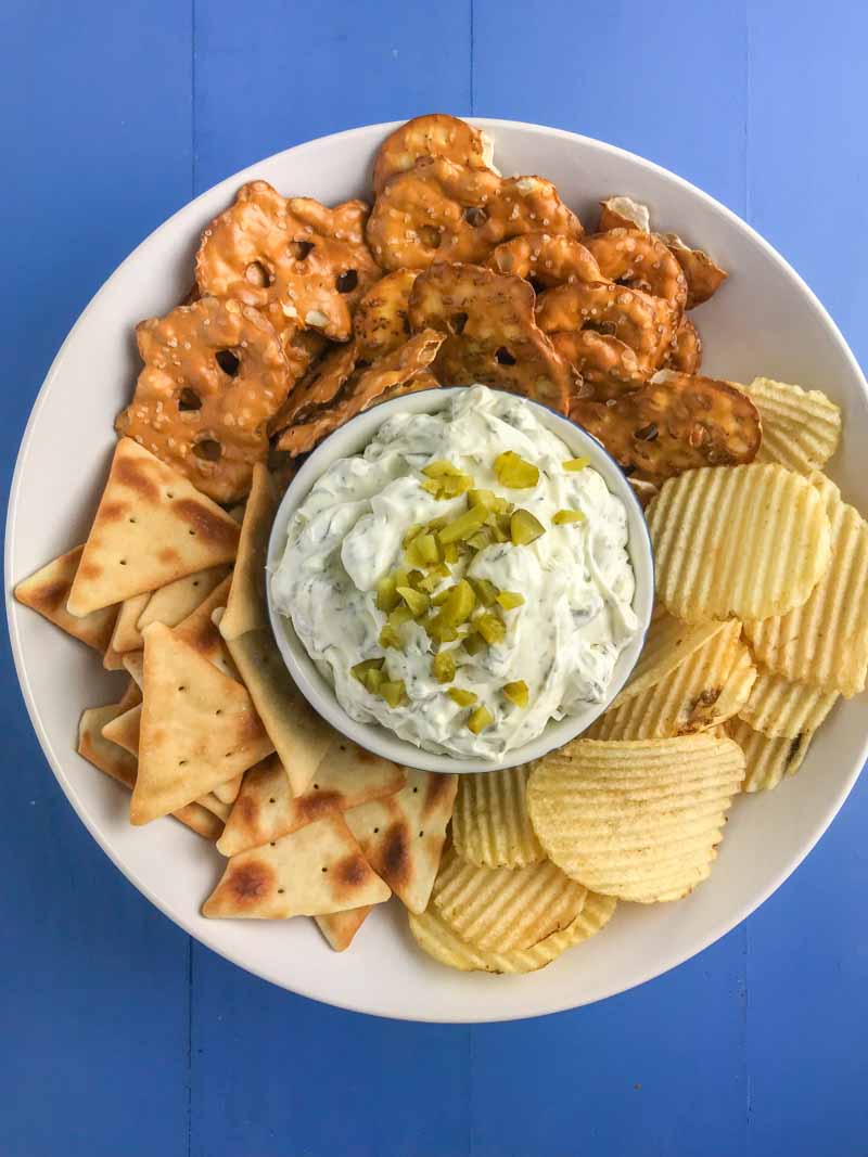 Creamy Dill Pickle Dip is going to be THE dip you'll want to bring to all your summer potlucks. It is super easy to make and a crowd pleaser! 