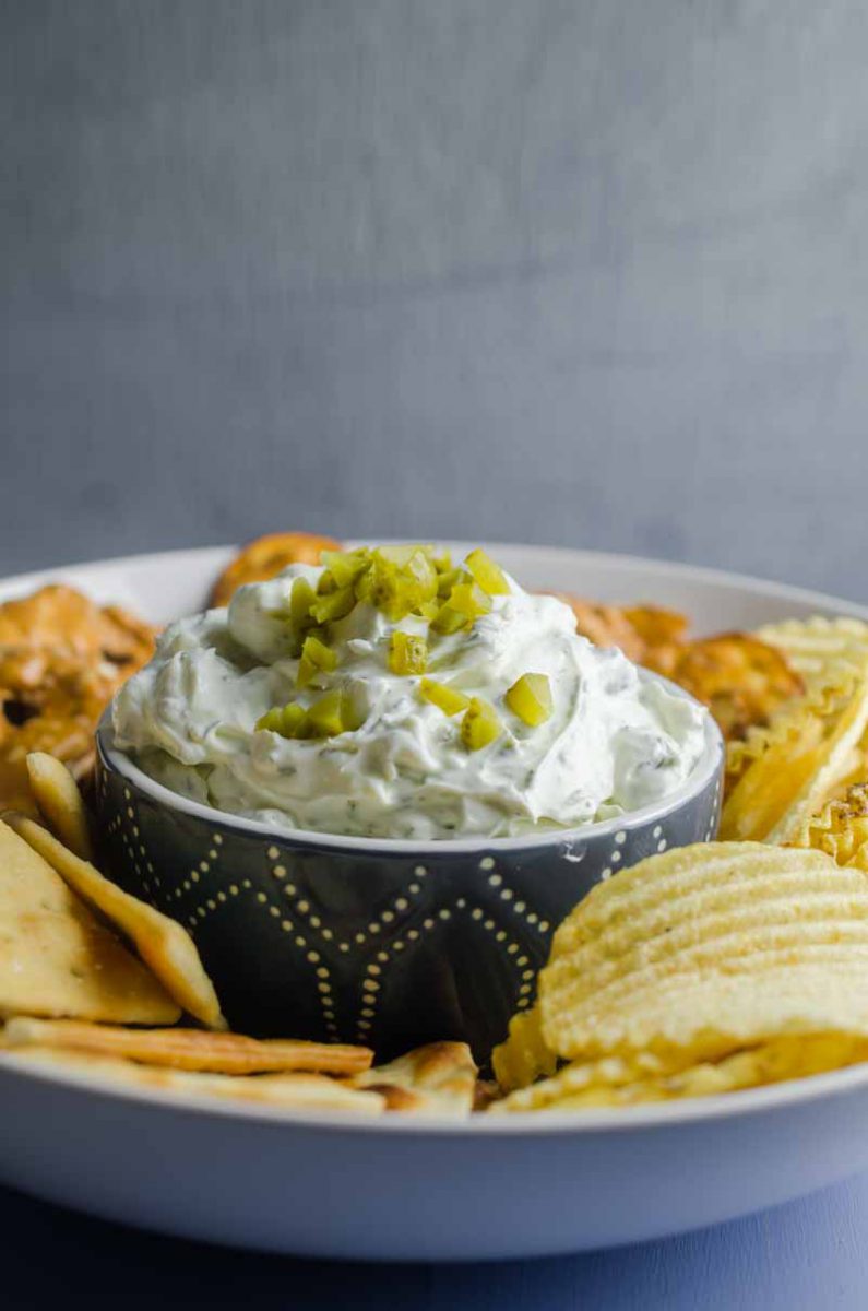 Creamy Dill Pickle Dip is going to be THE dip you'll want to bring to all your summer potlucks. It is super easy to make and a crowd pleaser! 
