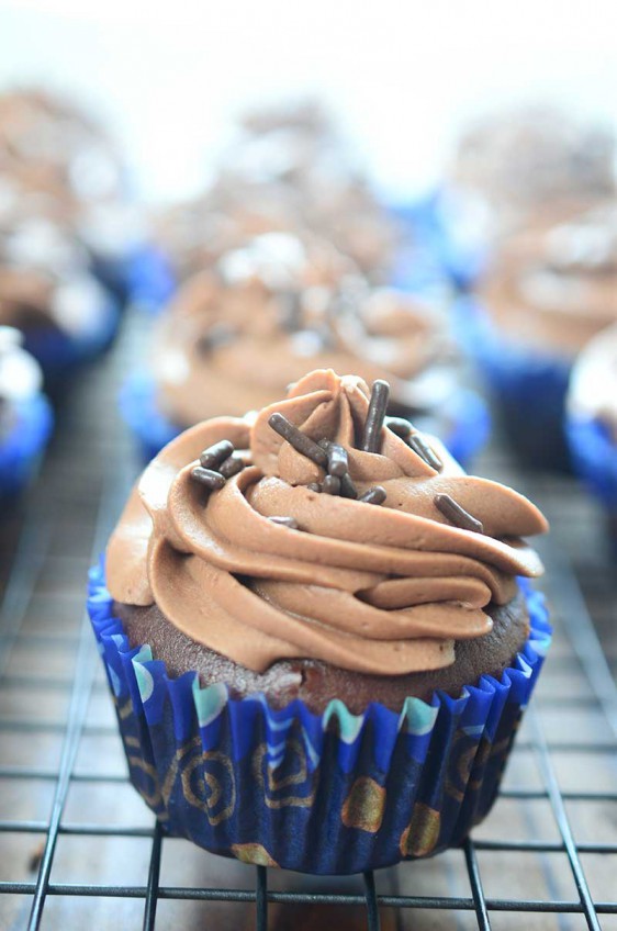 Triple Chocolate Cupcakes. Chocolate cupcake loaded with chocolate chips & topped with chocolate frosting. Chocolate lovers rejoice and then pass the milk!