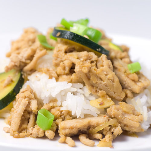 plate of ground chicken teriyaki on white rice.