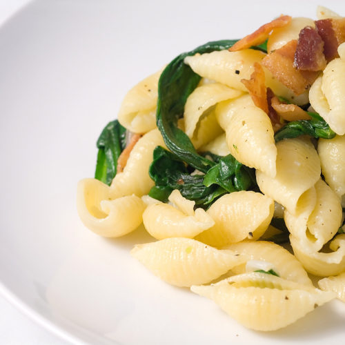 herb and garlic shells with spinach and bacon