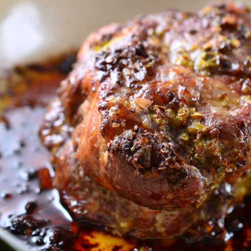 Jalapeno garlic pork shoulder in roasting pan.