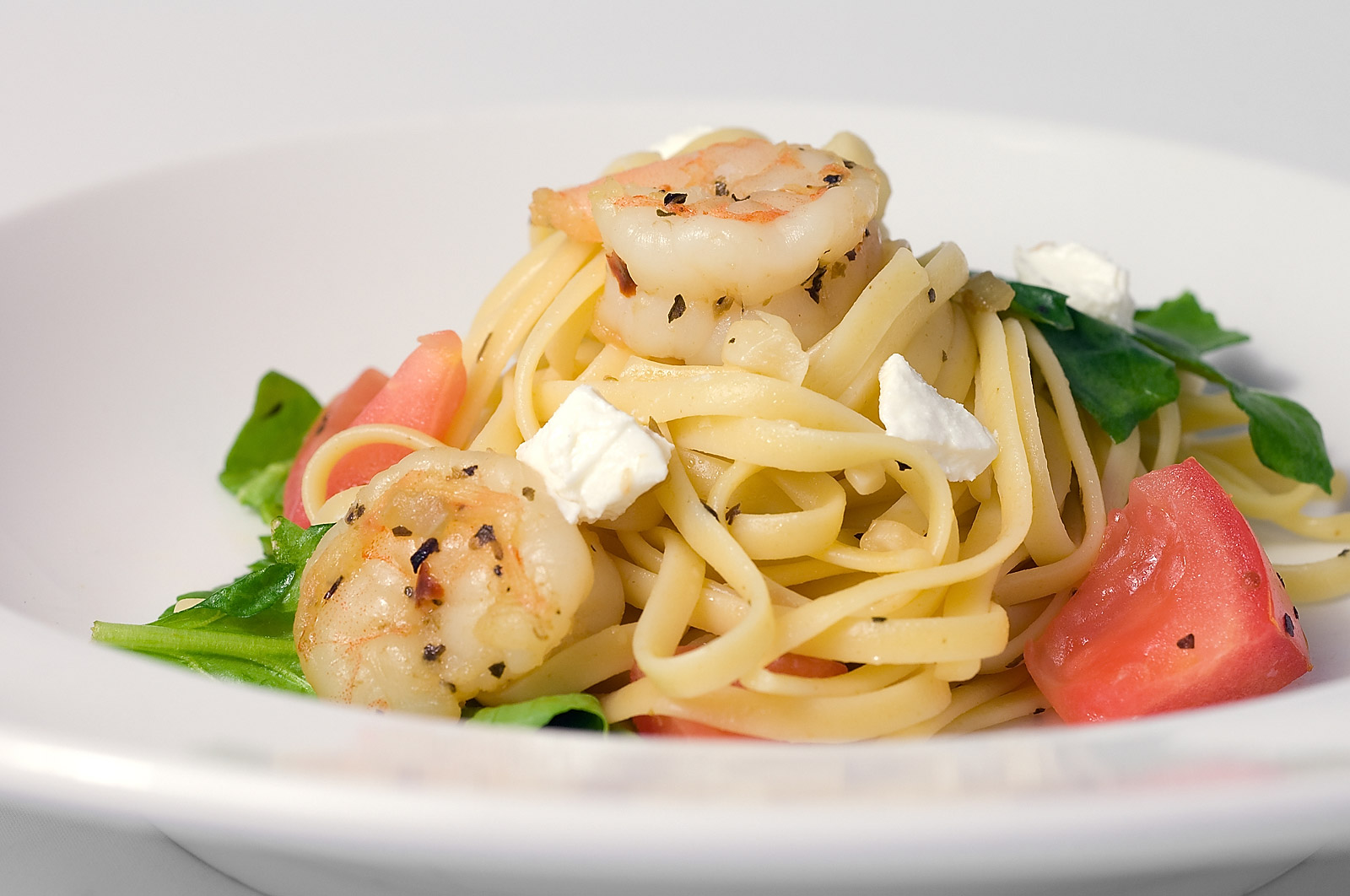 Linguinie with Prawns, Spinach, Tomatoes and Goat Cheese