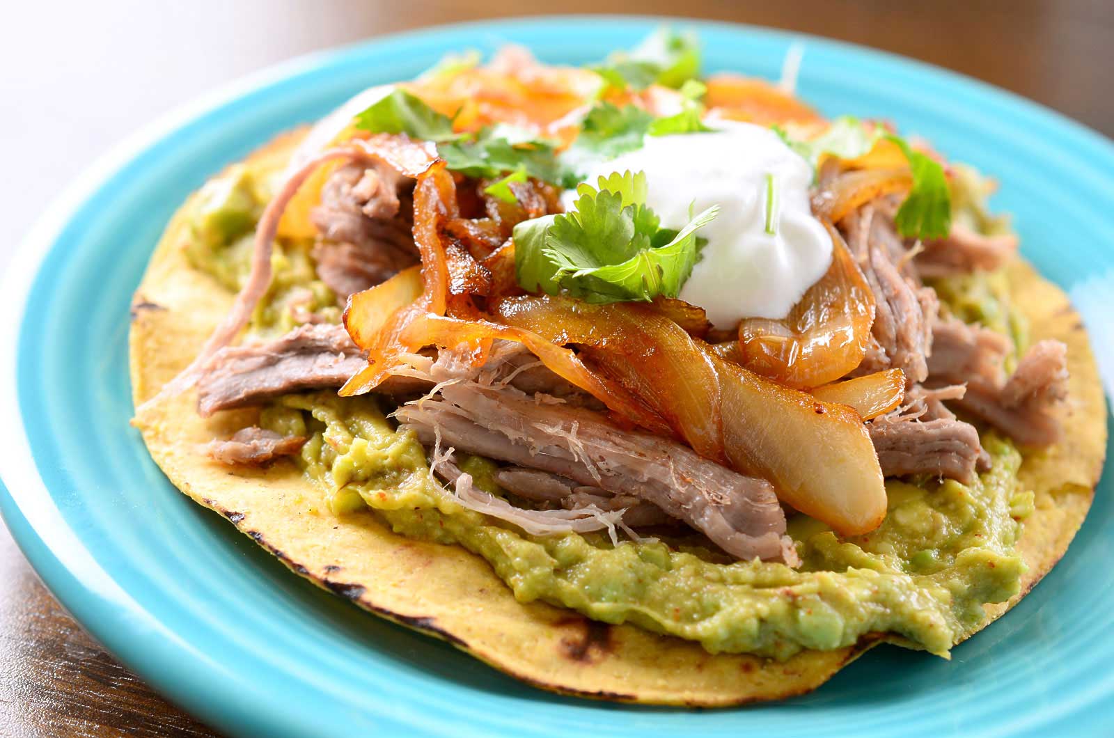 Pulled Pork Tostada with Chipotle Caramelized Onions
