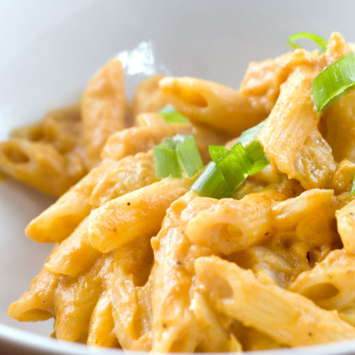 Pumpkin curry in white bowl.