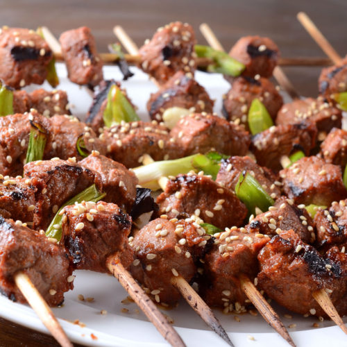 grilled beef skewers on plate.