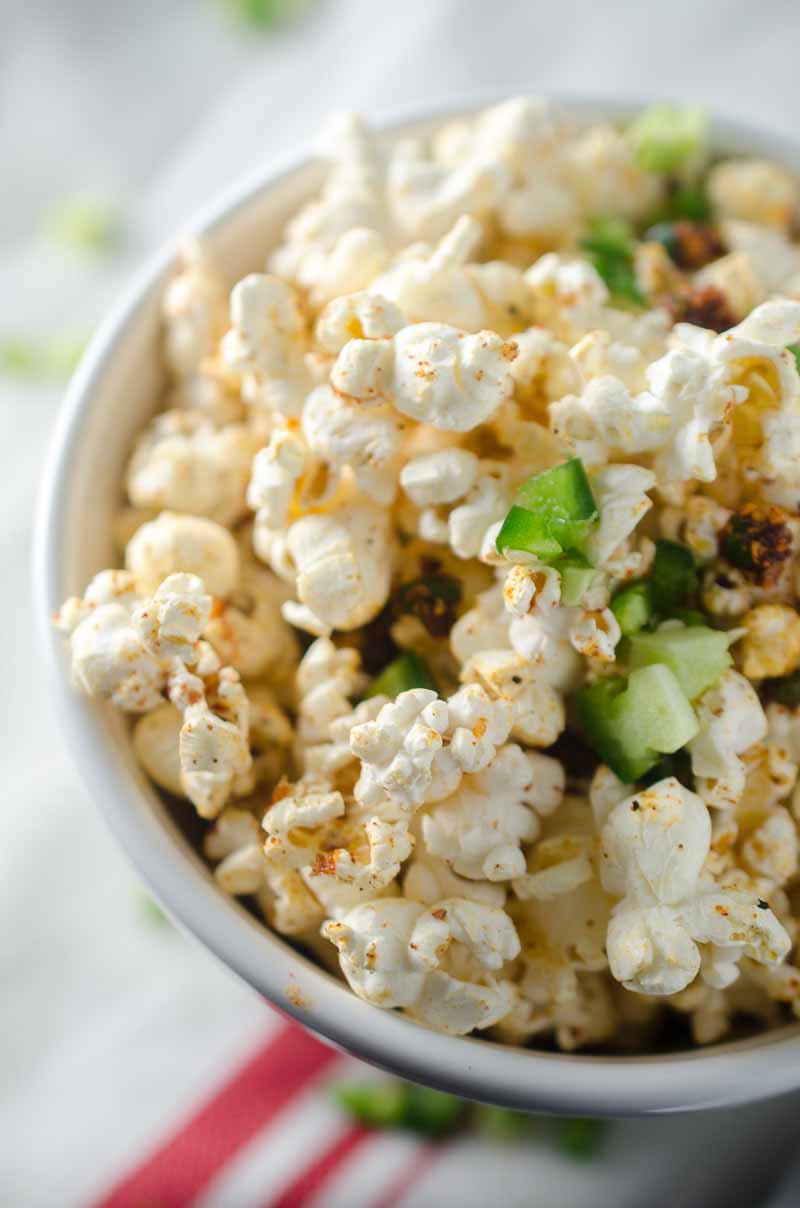 Sweet n' Spicy BBQ Popcorn is the perfect game day snack! Popcorn drizzled with jalapeño butter and sprinkled with BBQ seasoning and a pinch of brown sugar.