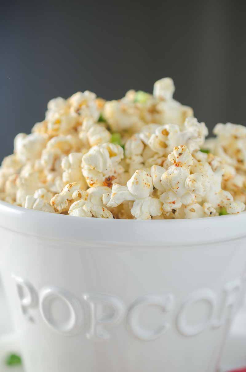 Sweet n' Spicy BBQ Popcorn is the perfect game day snack! Popcorn drizzled with jalapeño butter and sprinkled with BBQ seasoning and a pinch of brown sugar.