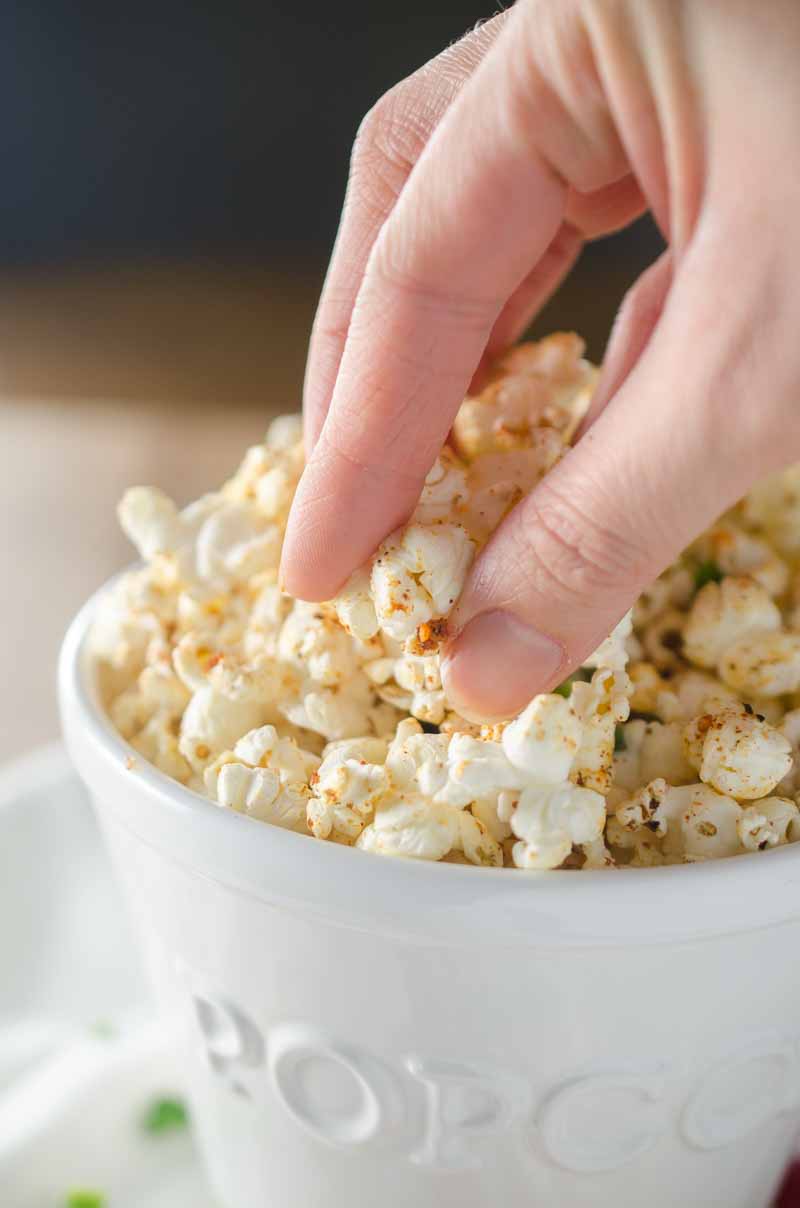 Sweet n' Spicy BBQ Popcorn is the perfect game day snack! Popcorn drizzled with jalapeño butter and sprinkled with BBQ seasoning and a pinch of brown sugar.