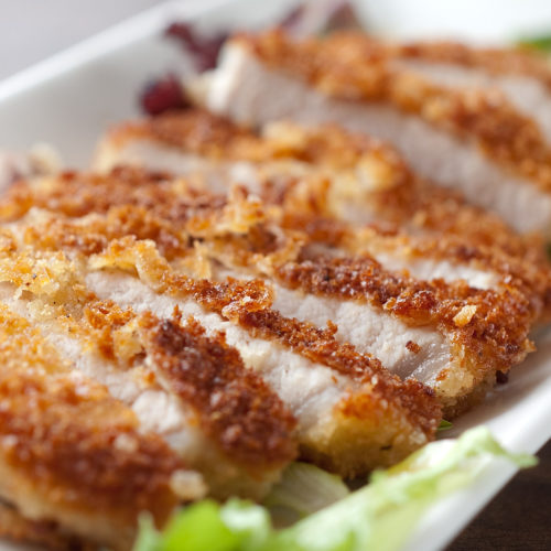 close up of tonkatsu pork on plate.