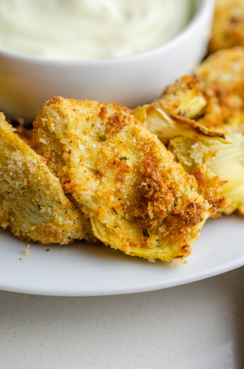 Close up of a pile of air fried artichoke hearts.