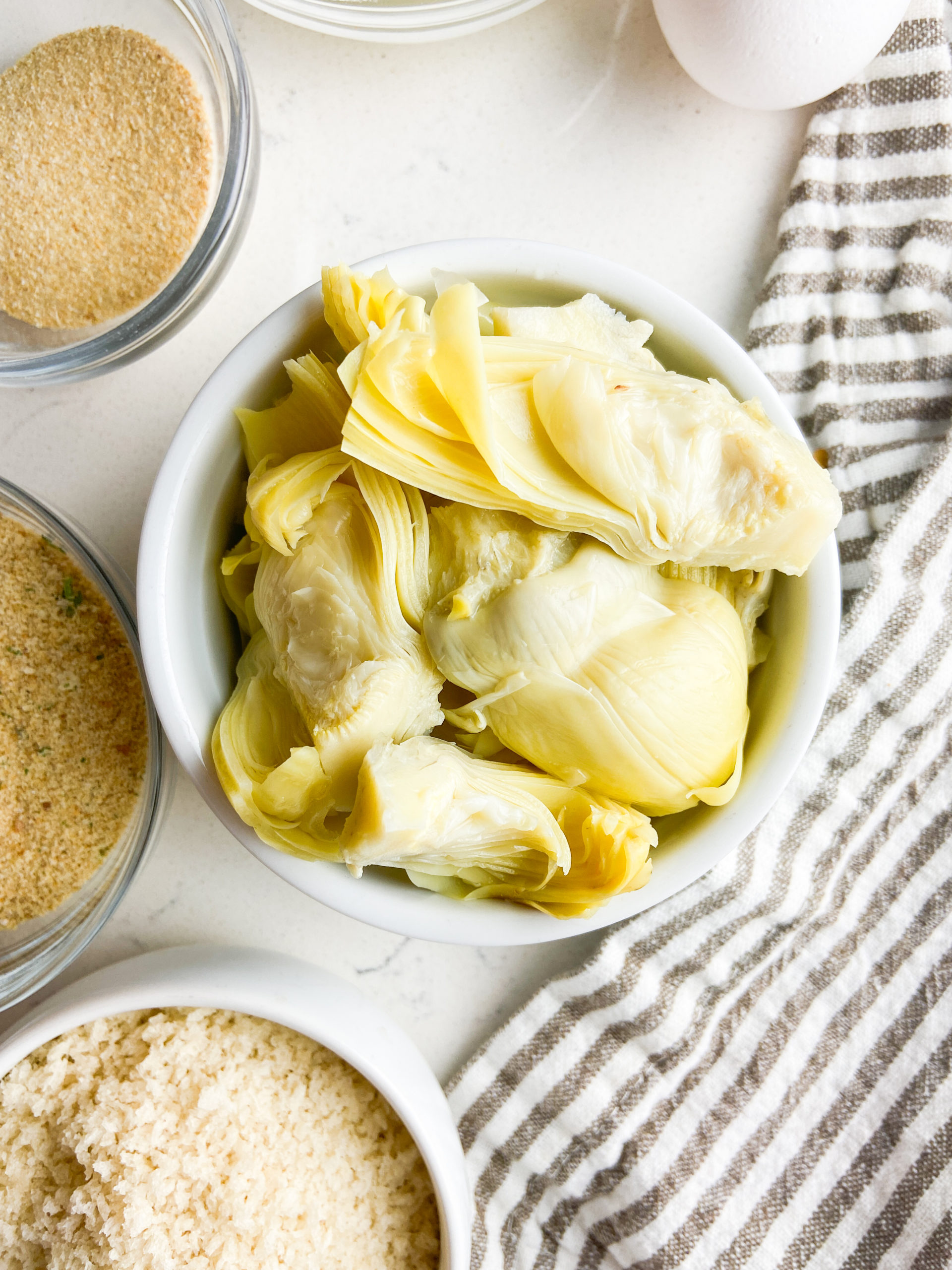 Overhead photo of ingredients needed for crispy artichoke hearts. 