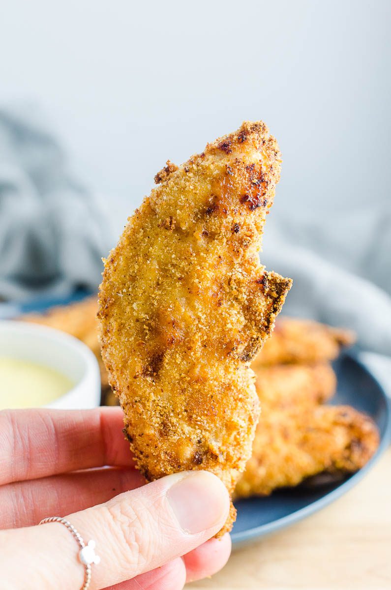 A single air fried chicken strip. 