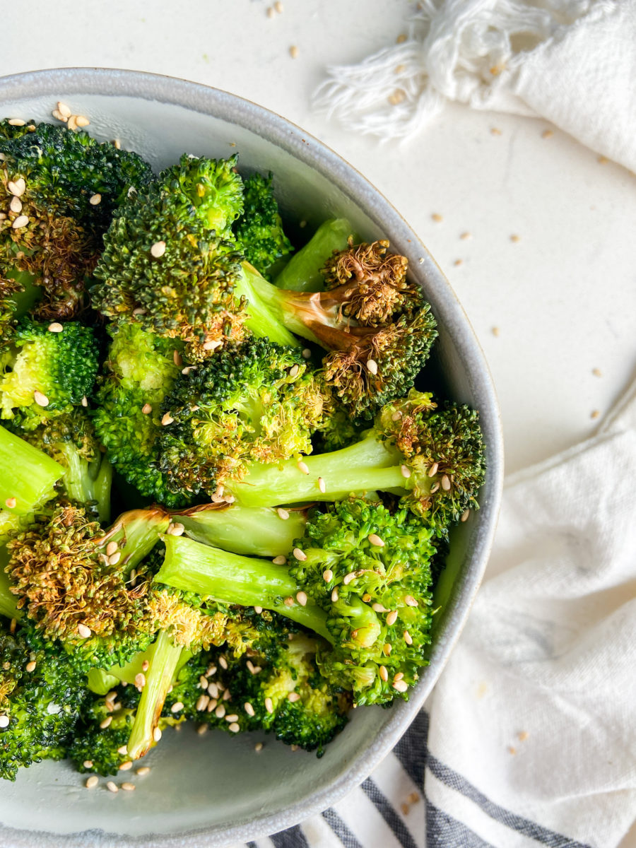 Overhead side shot of sesame broccoli in a bowl. 