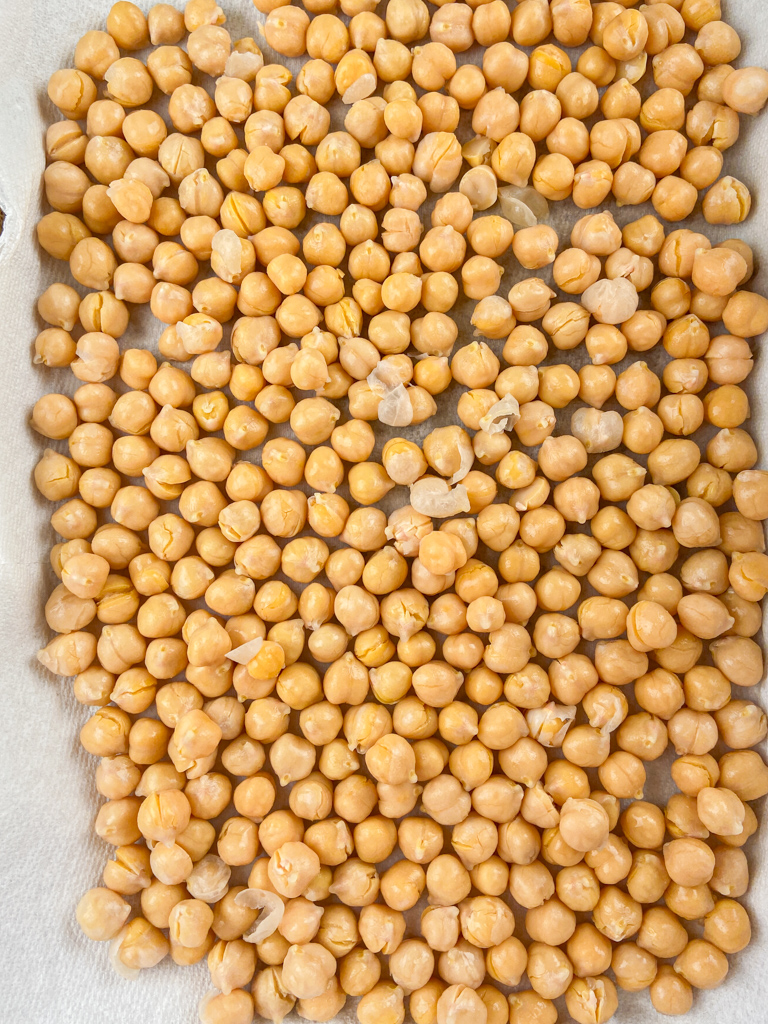 Overhead photo of chickpeas drying on a papertowel. 