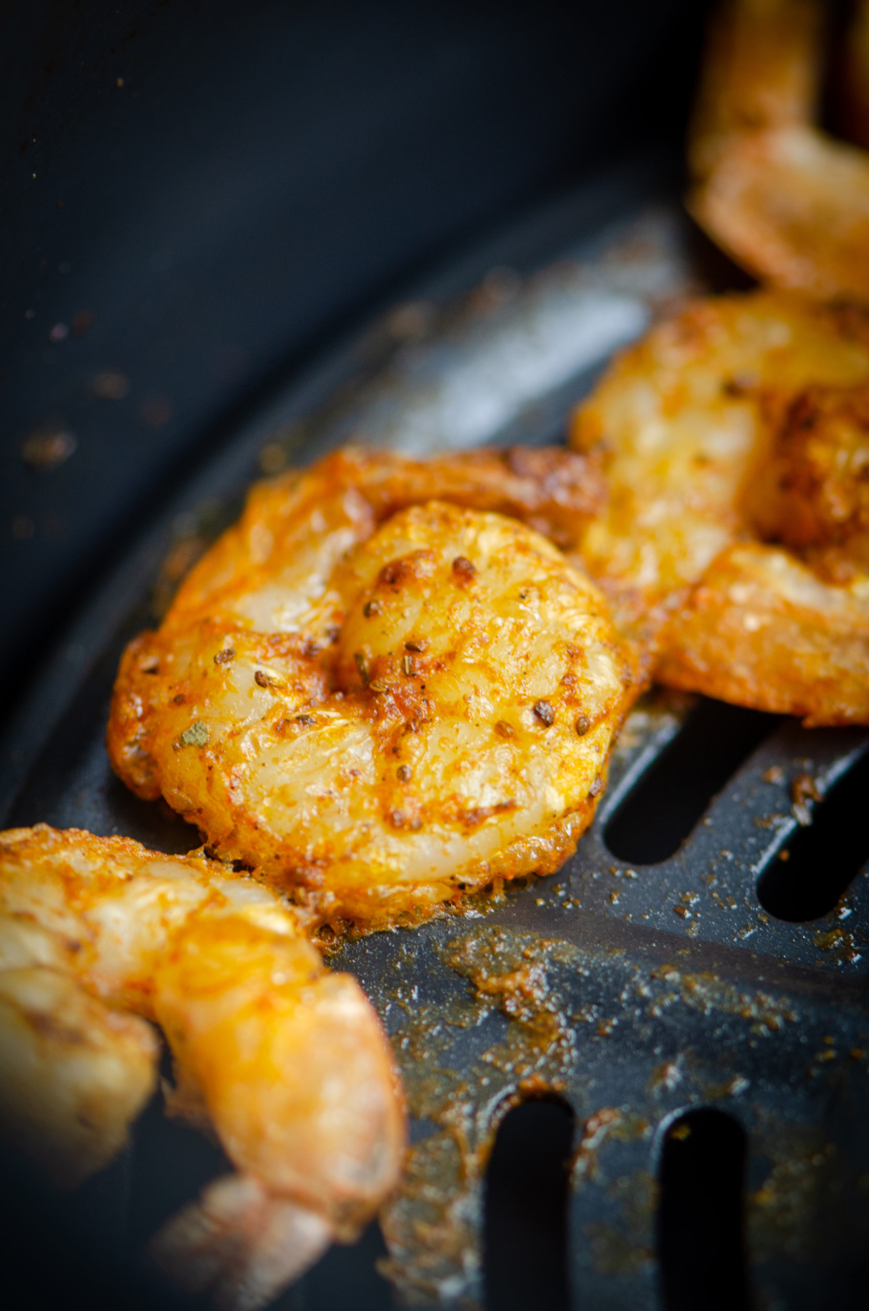 Close up of shrimp in air fryer. 