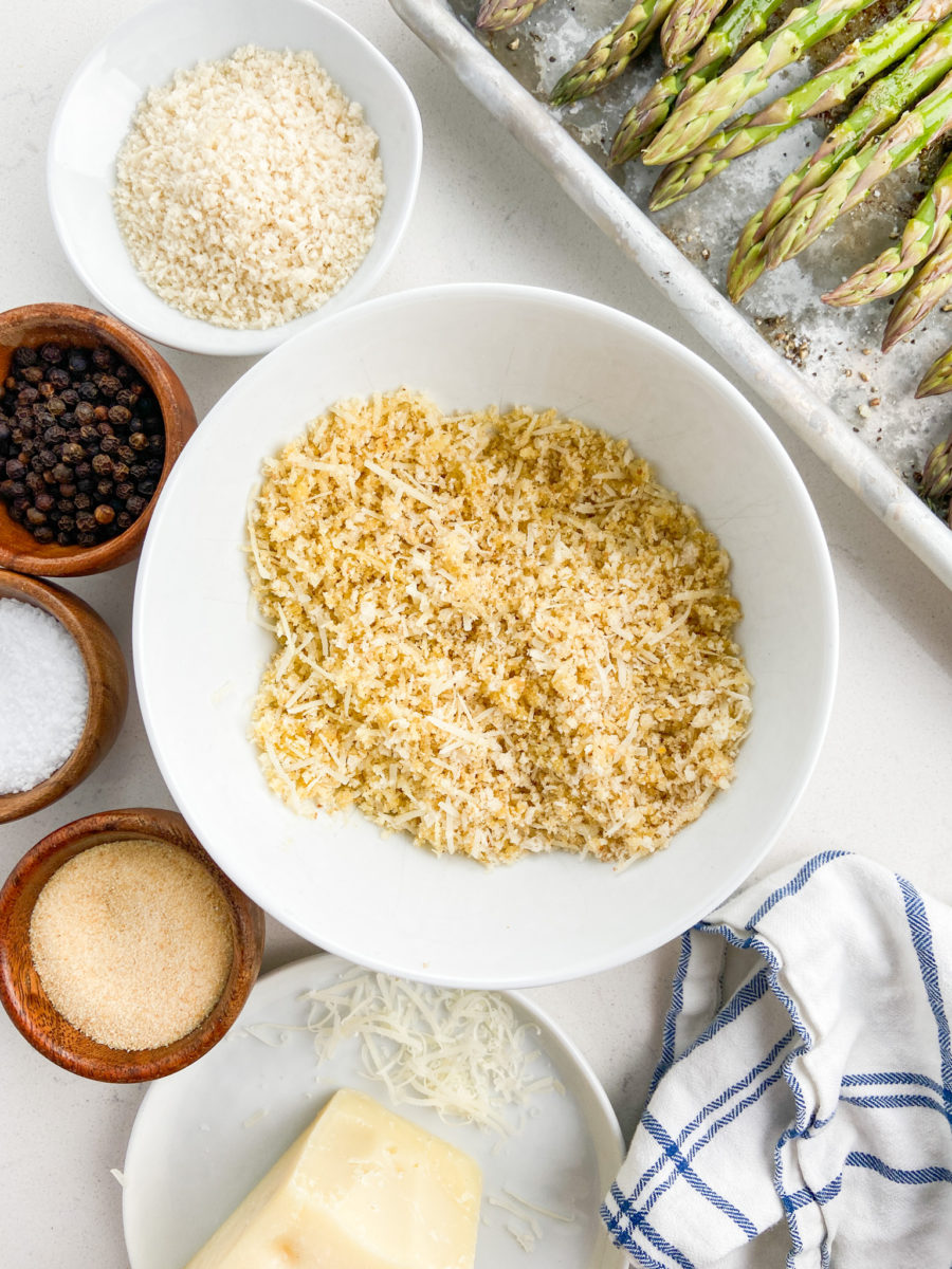 Seasoned breadcrumbs and parmesan in white bowl. 