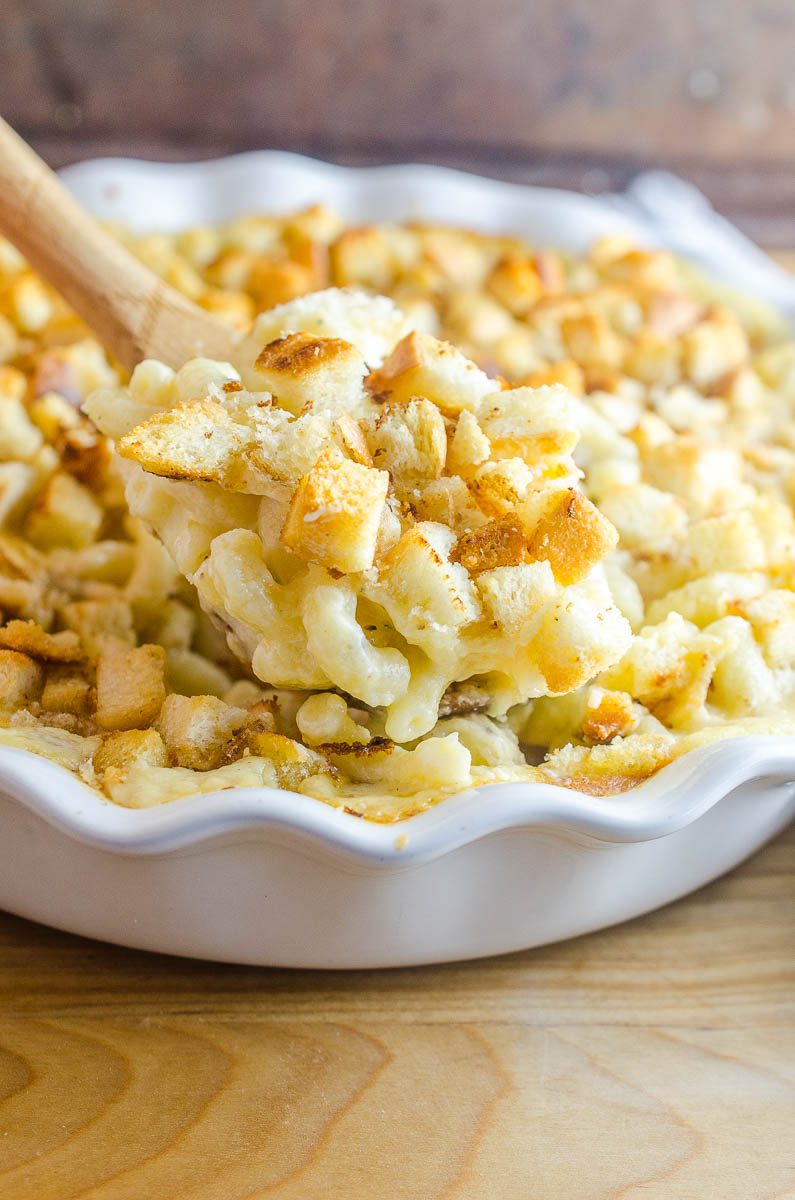 Oven Baked Macaroni And Cheese is a classic comfort food side dish. This easy mac n' cheese recipe is creamy and cheesy, topped with bread crumbs and baked.