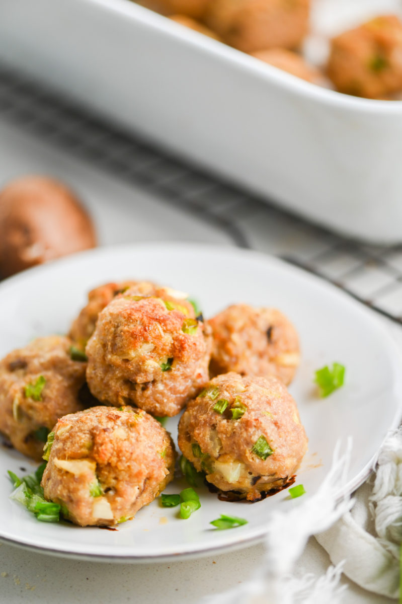 Baked turkey meatballs on white plate. 