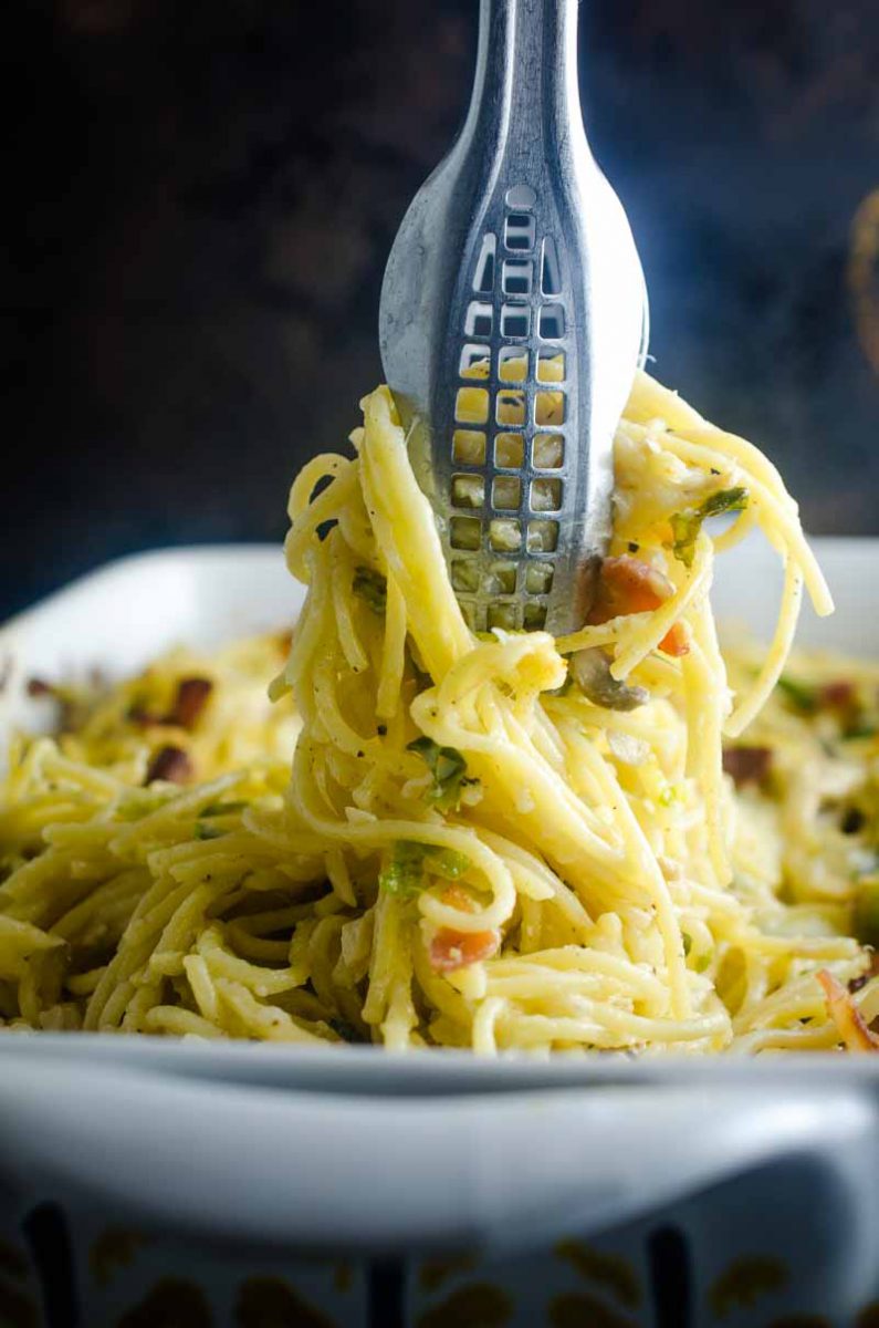 Use your leftover turkey to make this creamy Baked Turkey Spaghetti. Loaded with shredded turkey, brussels sprouts, mushrooms, bacon and cheese. 