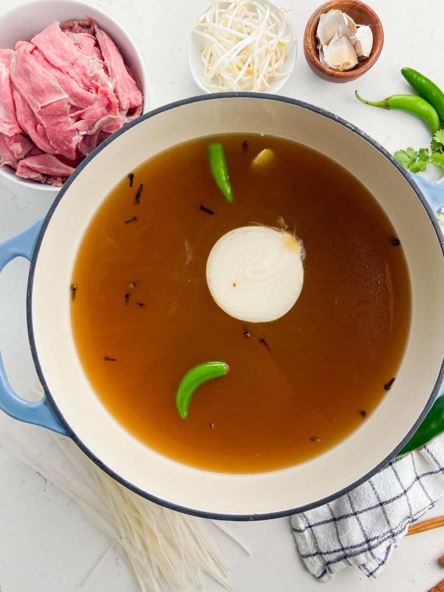 Beef noodle broth in pot. 