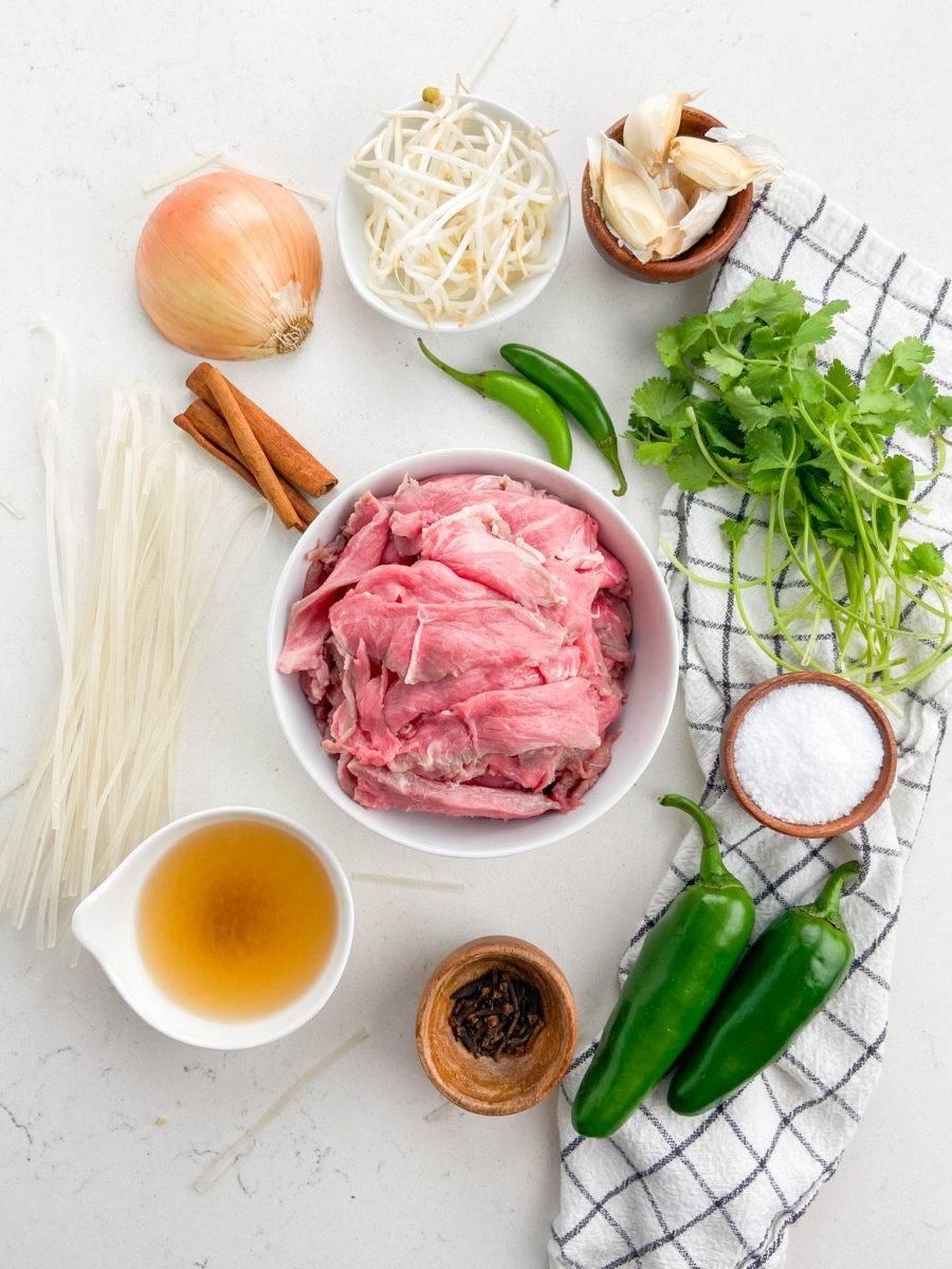 Overhead photo of beef noodle soup ingredients. 