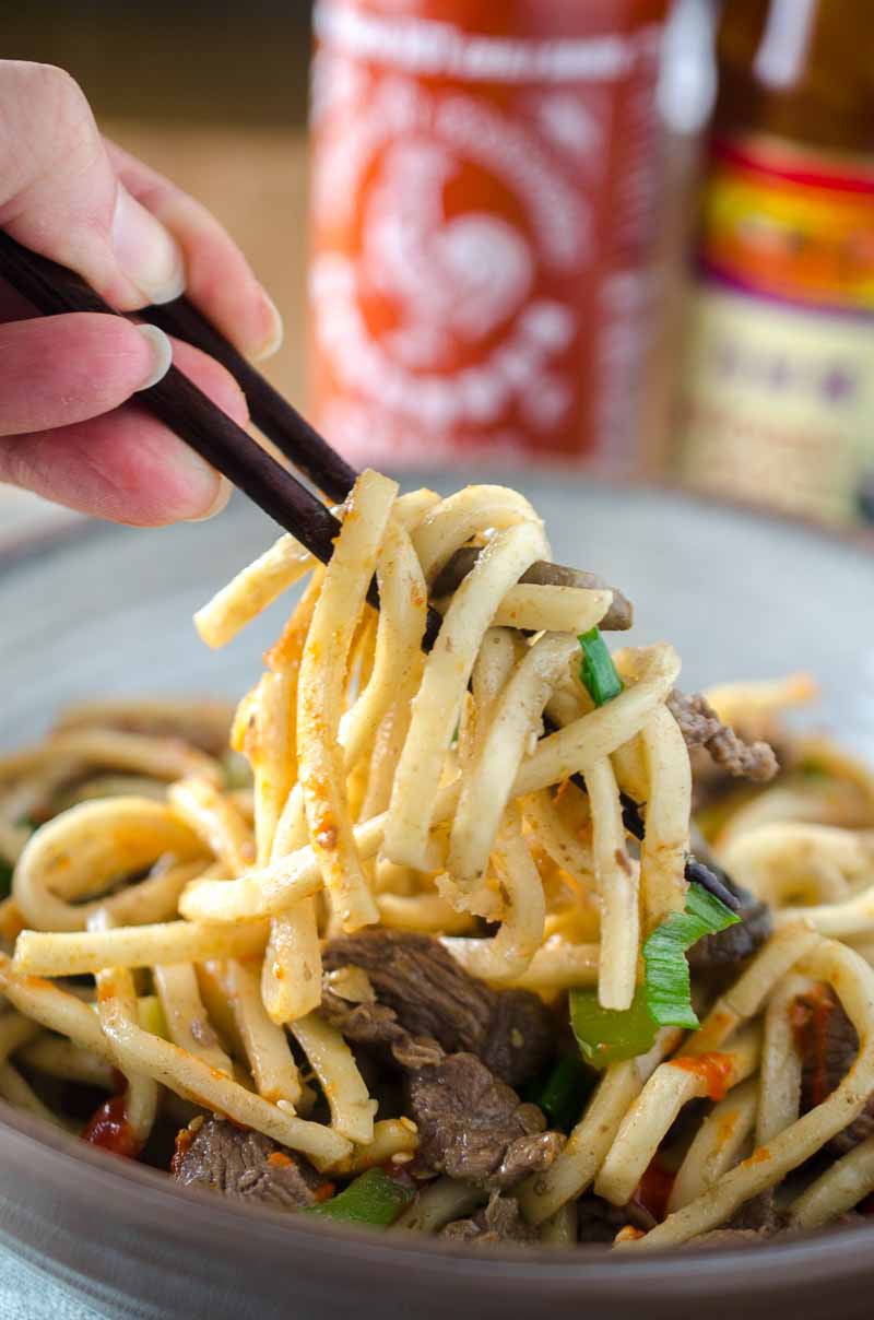 Beef noodle stir-fry is one of my favorite comfort foods. It is loaded with thinly sliced beef, peppers, mushrooms, onions and udon noodles. 