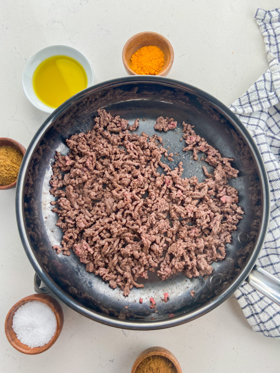 Ground beef in a skillet. 