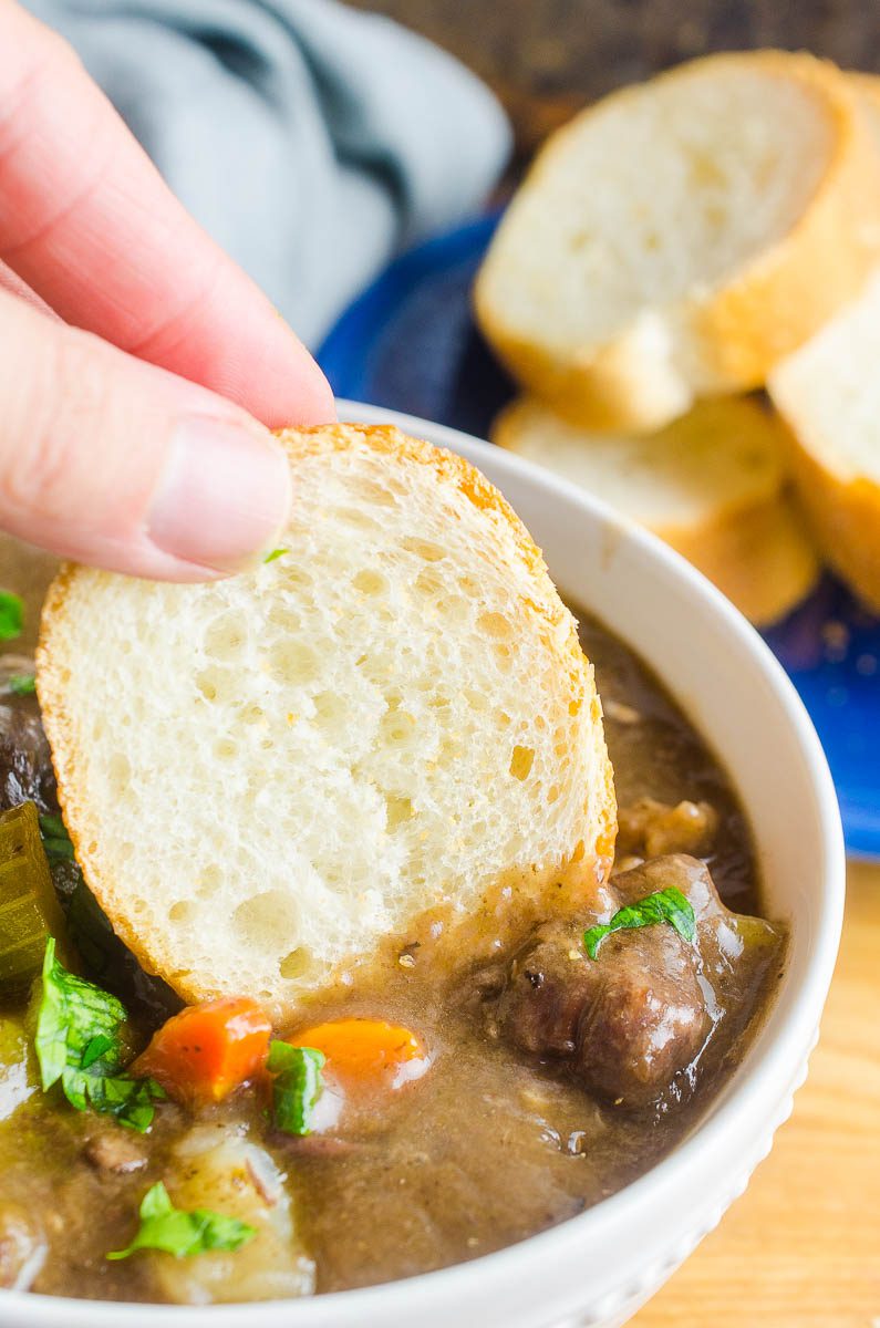 Bread dipping in beef stew. 