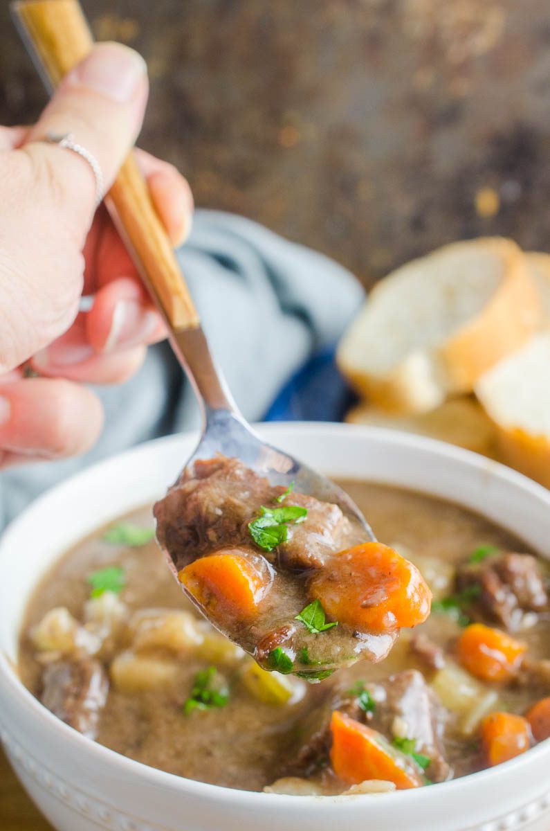 A spoonful of beef stew with red wine.