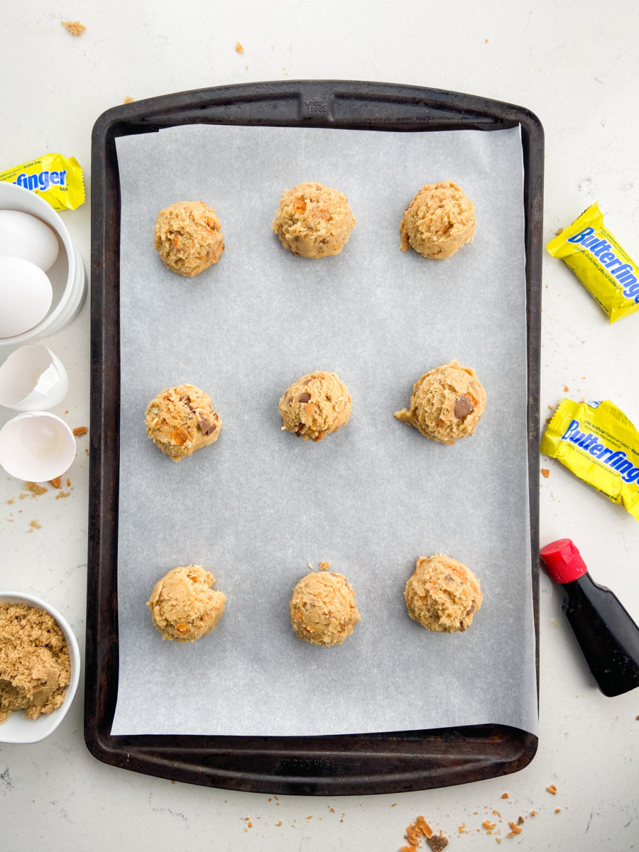 Butterfinger cookie dough on baking sheet. 