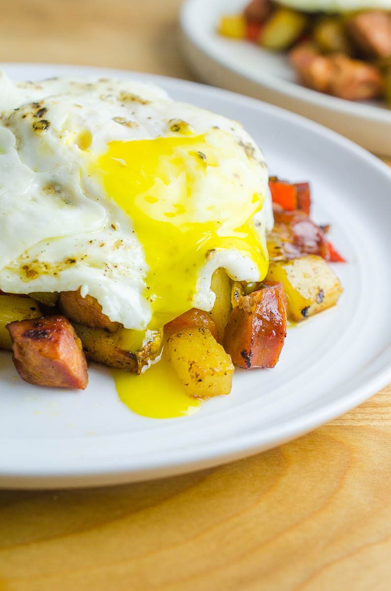 Cajun breakfast skillet with a runny egg on top. 