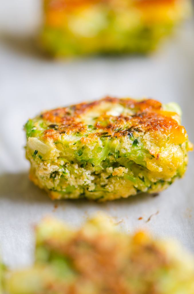 Side angle photo of baked cheddar broccoli tots. 