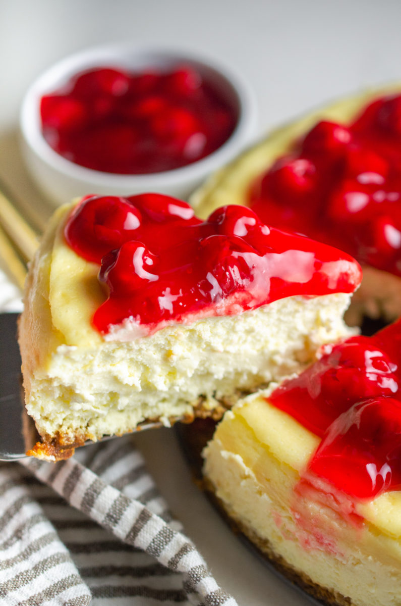 Serving a slice of cheesecake. 