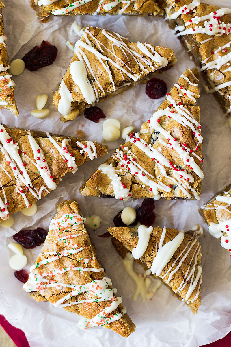These Christmas Blondies are chewy and full of white chocolate and dried cranberries for that perfect sweet and tart combo! 