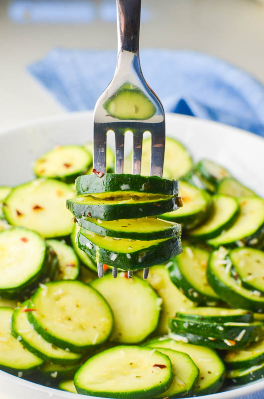 Zucchini salad on a fork. 