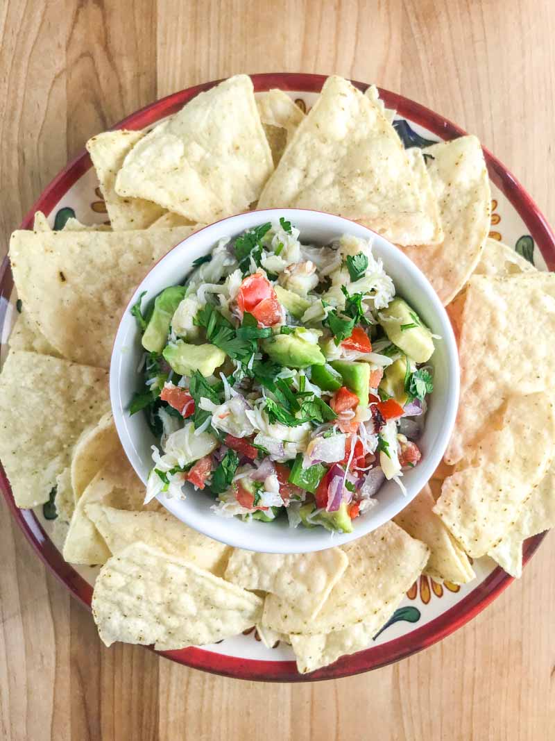 Crab ceviche is a fun twist on a classic! A mixture of Dungeness crab, tomatoes, serrano peppers, onions, lemon, lime, cilantro and avocado. It's like sunshine in a bowl. 