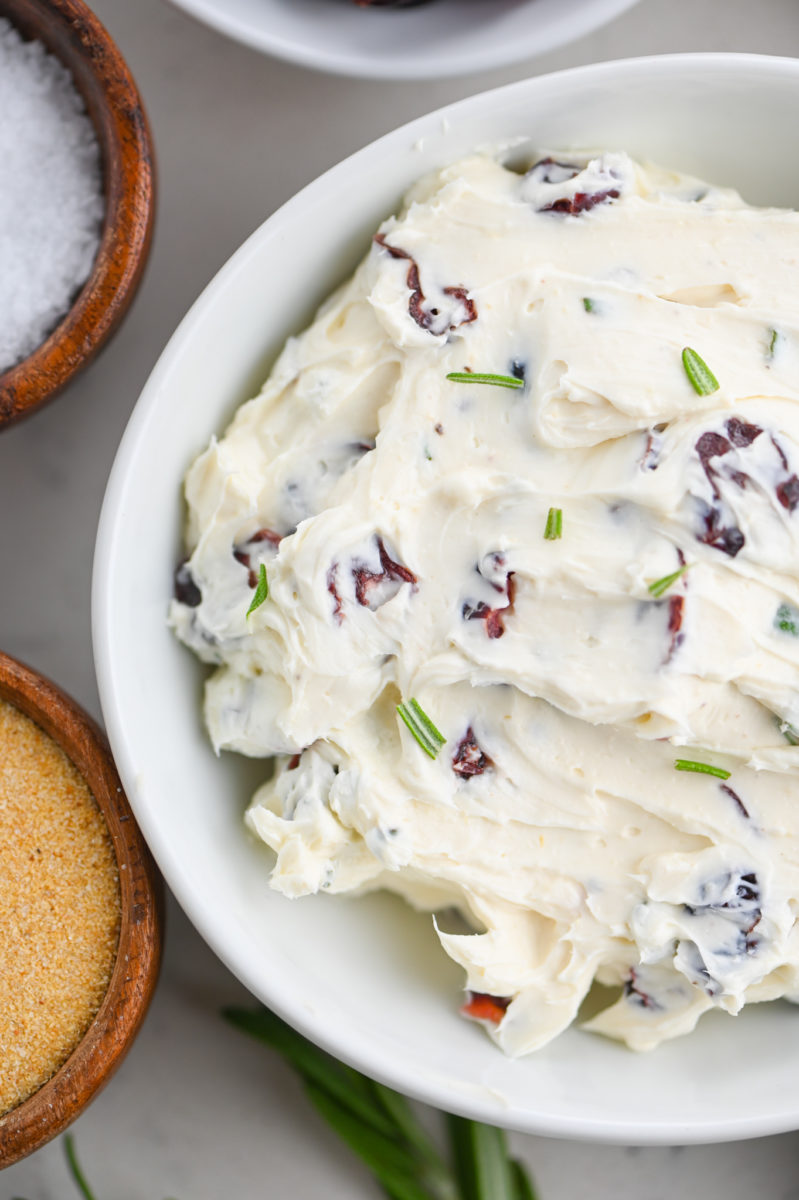 Cranberry cream cheese in white bowl.